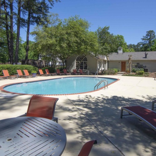a pool with chairs around it