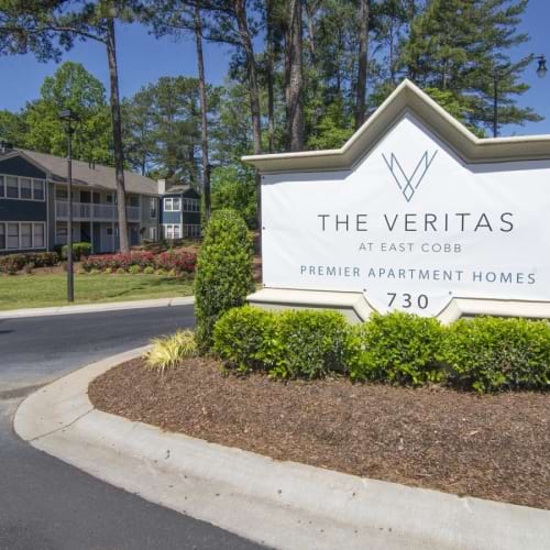 a sign in front of a building