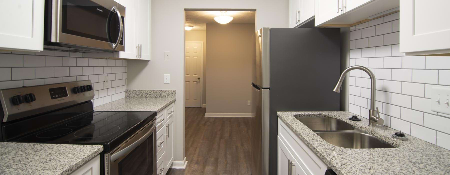 a kitchen with white cabinets